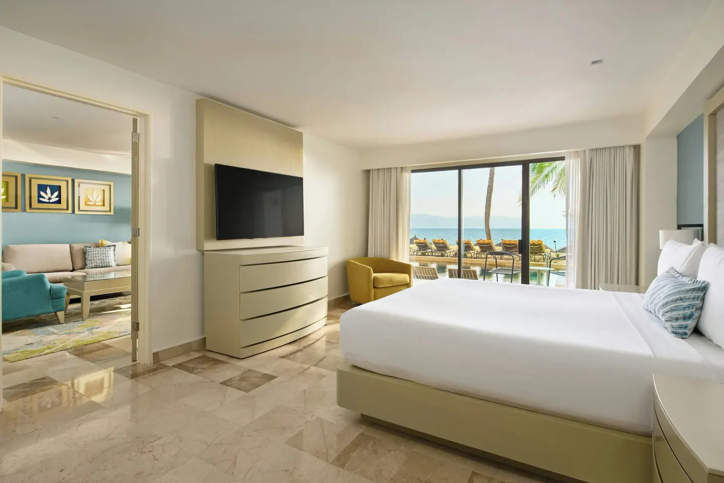 One-bedroom suite with king bed and ocean-facing terrace at Marriott Puerto Vallarta Resort & Spa.