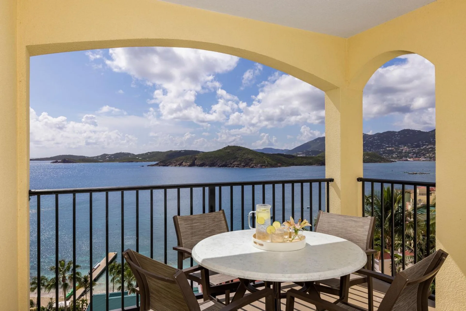 Balcony dining table with island and ocean view at Marriott's Frenchman's Cove.