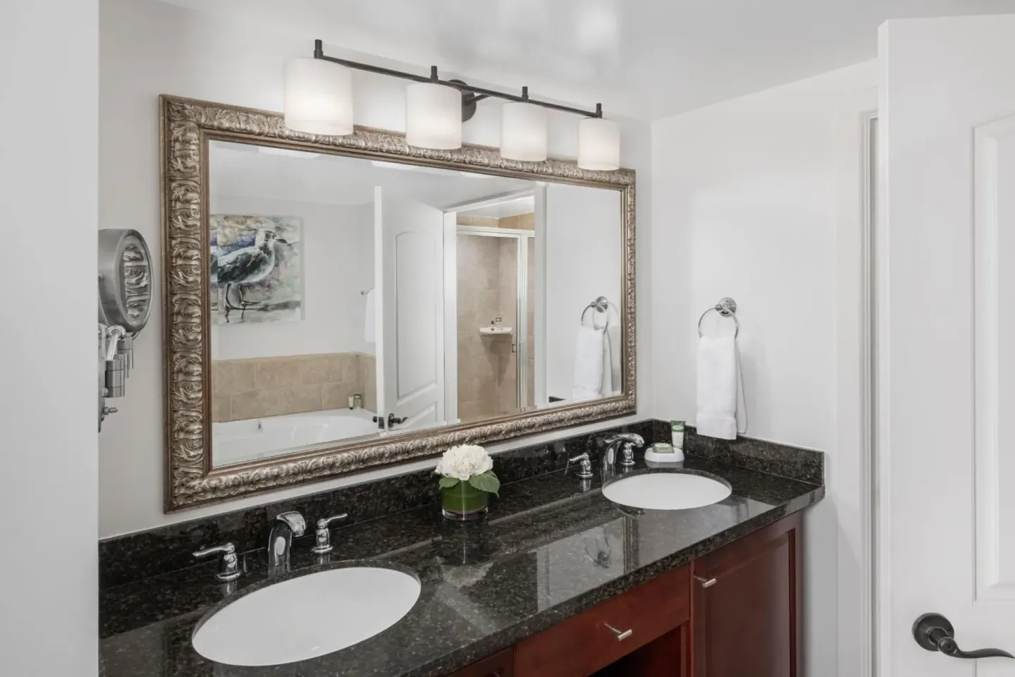 Double-sink bathroom vanity with large mirror at Marriott's Frenchman's Cove.