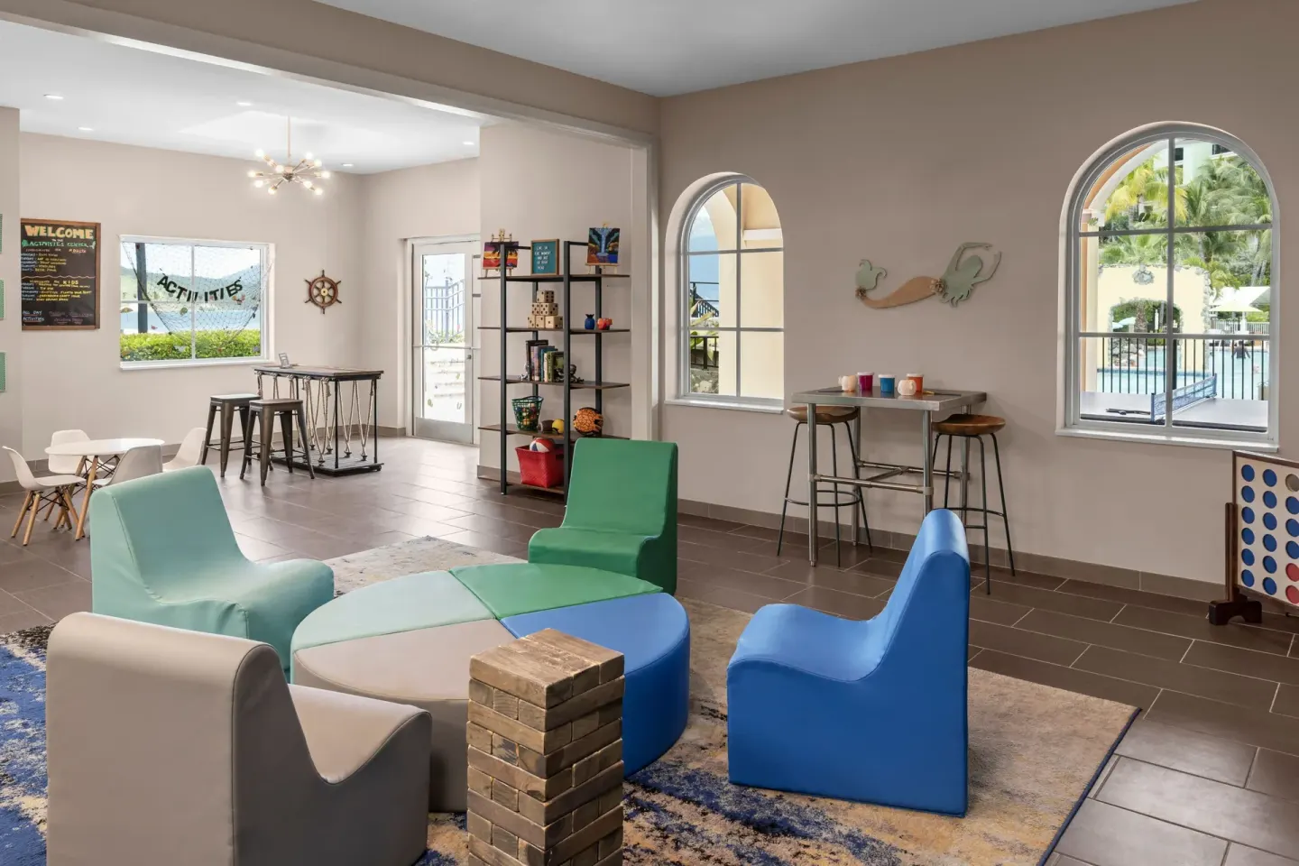 Kids' activity lounge with games and colorful seating at Marriott's Frenchman's Cove.