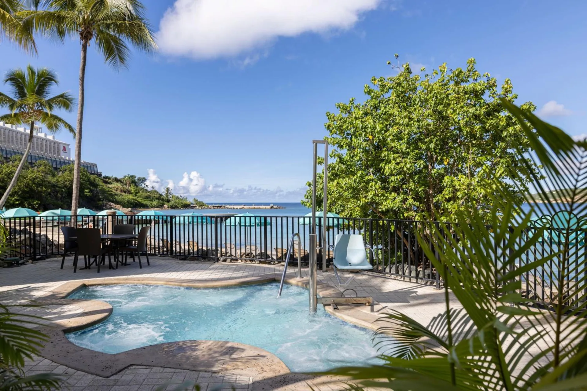 Pool terrace with water feature and bay view at Marriott's Frenchman's Cove.