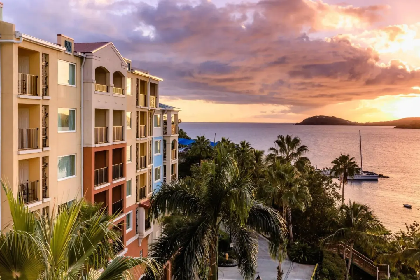 Resort building and waterfront at sunset at Marriott's Frenchman's Cove.