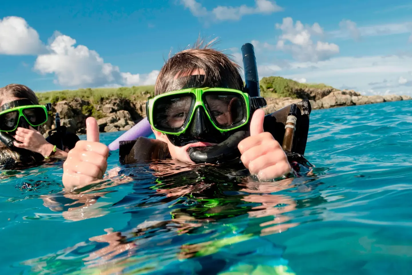 Snorkelers in clear blue water near Marriott's Frenchman's Cove.