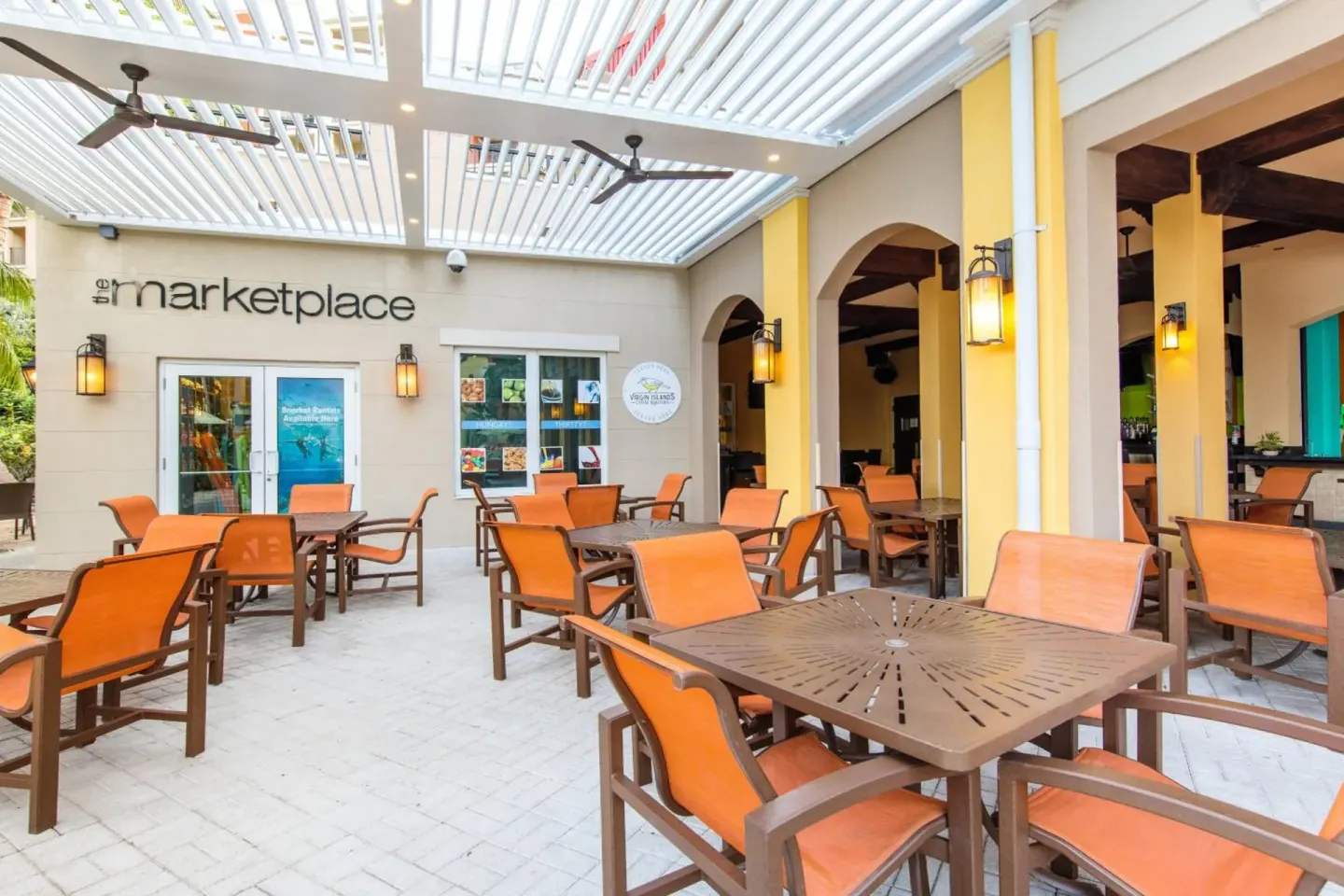 Outdoor patio seating by The Marketplace at Marriott's Frenchman's Cove.