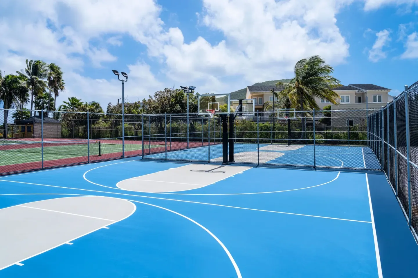 Outdoor basketball court beside tennis courts at Marriott's St. Kitts Beach Club.