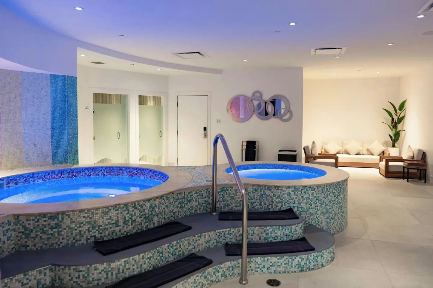Indoor spa whirlpools with mosaic tile and lounge seating at Marriott's St. Kitts Beach Club.