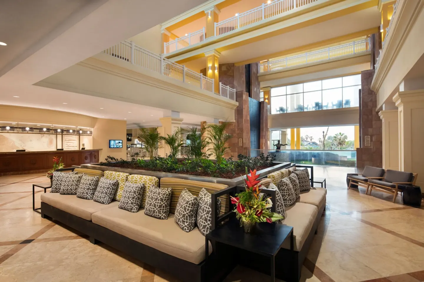 Open lobby lounge with sofas and indoor plants at Marriott's St. Kitts Beach Club.