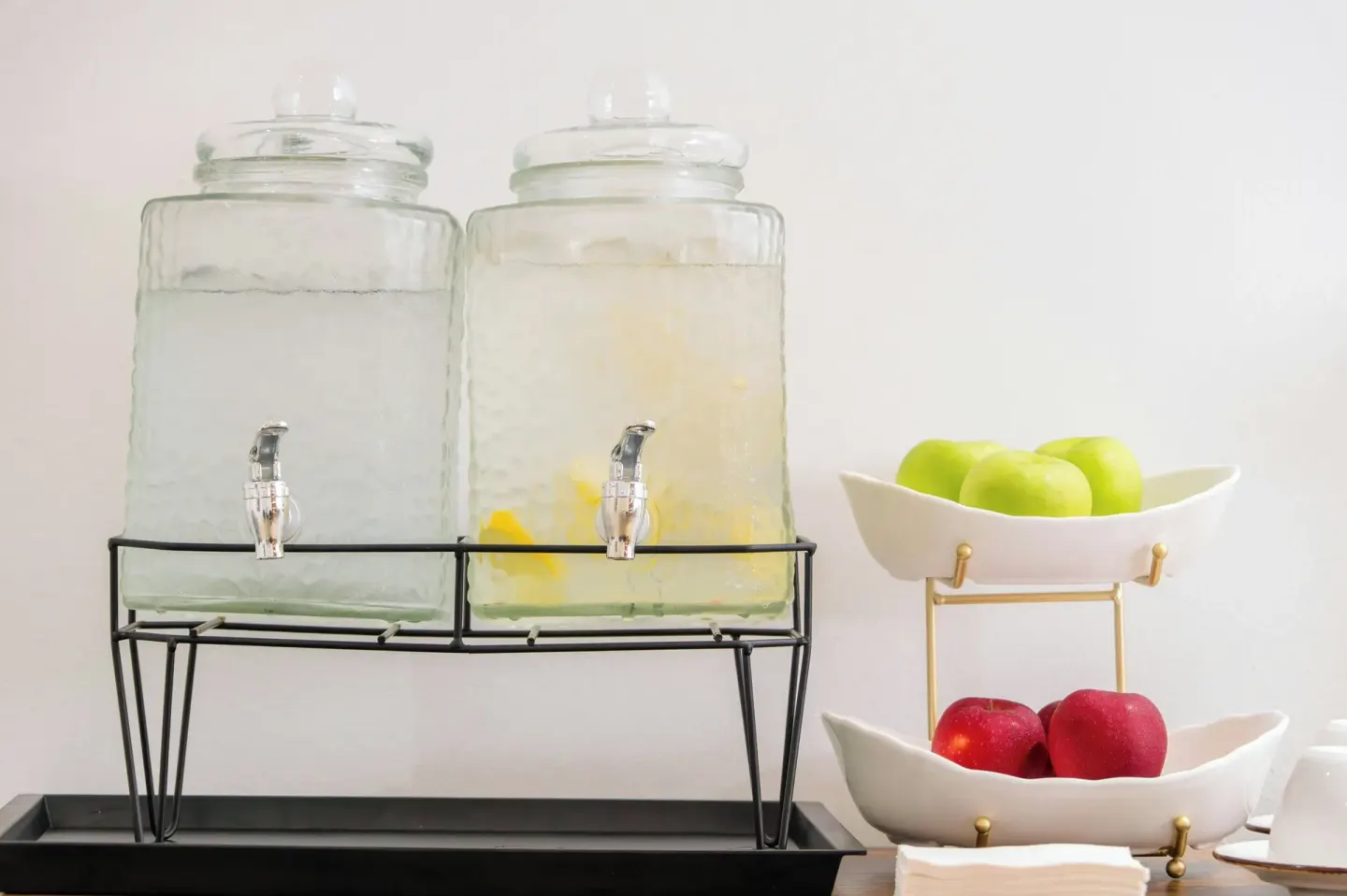 Infused water dispensers and bowls of apples at Marriott's St. Kitts Beach Club.