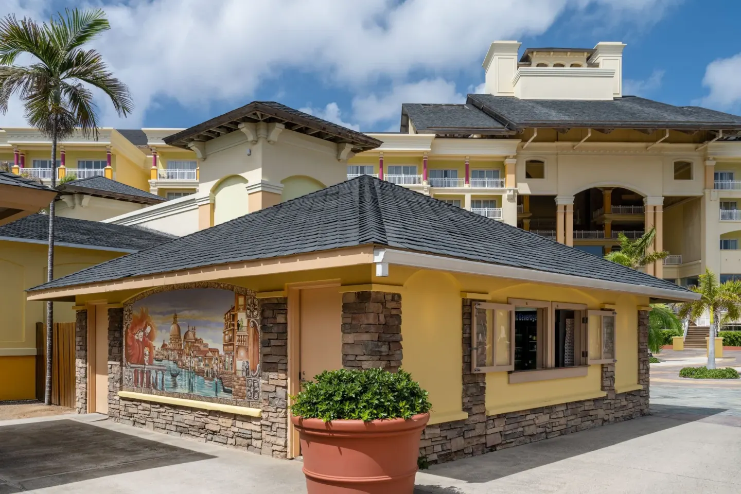 Exterior building with mural and resort towers at Marriott's St. Kitts Beach Club.