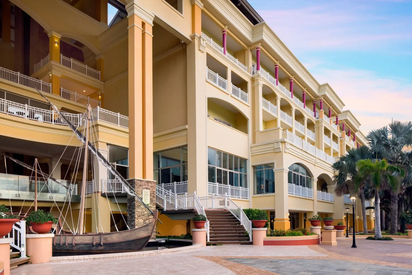 Exterior courtyard with balconies and a boat display at Marriott's St. Kitts Beach Club.