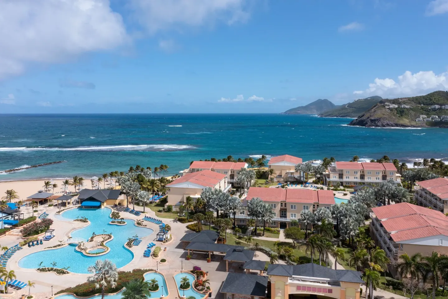 Aerial view of pools, beach, and ocean at Marriott's St. Kitts Beach Club.
