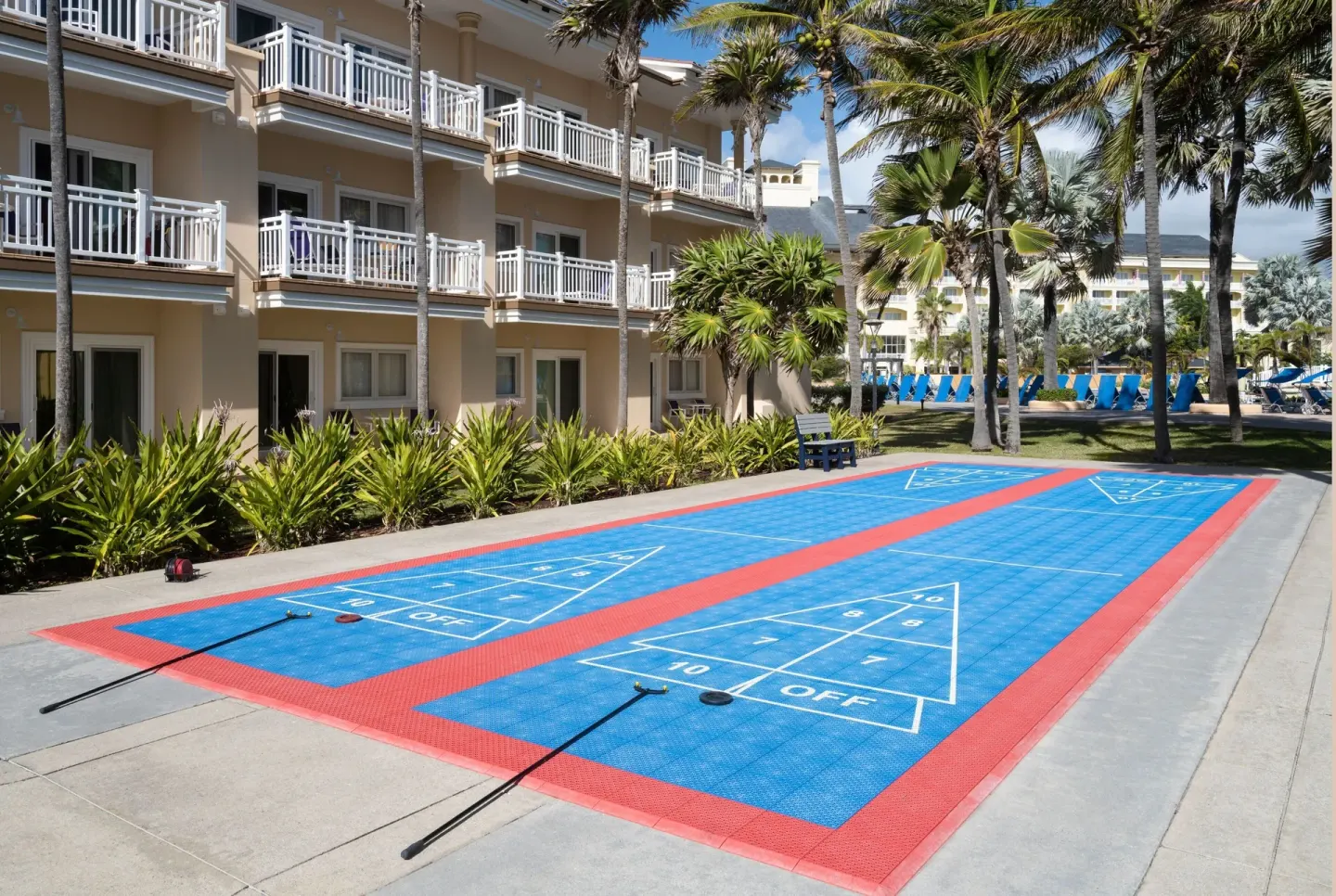 Shuffleboard courts beside guest balconies at Marriott's St. Kitts Beach Club.