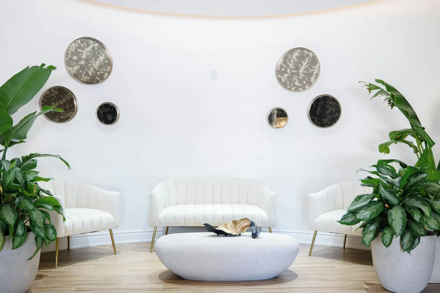 Bright lounge seating with plants and wall mirrors at Marriott's St. Kitts Beach Club.