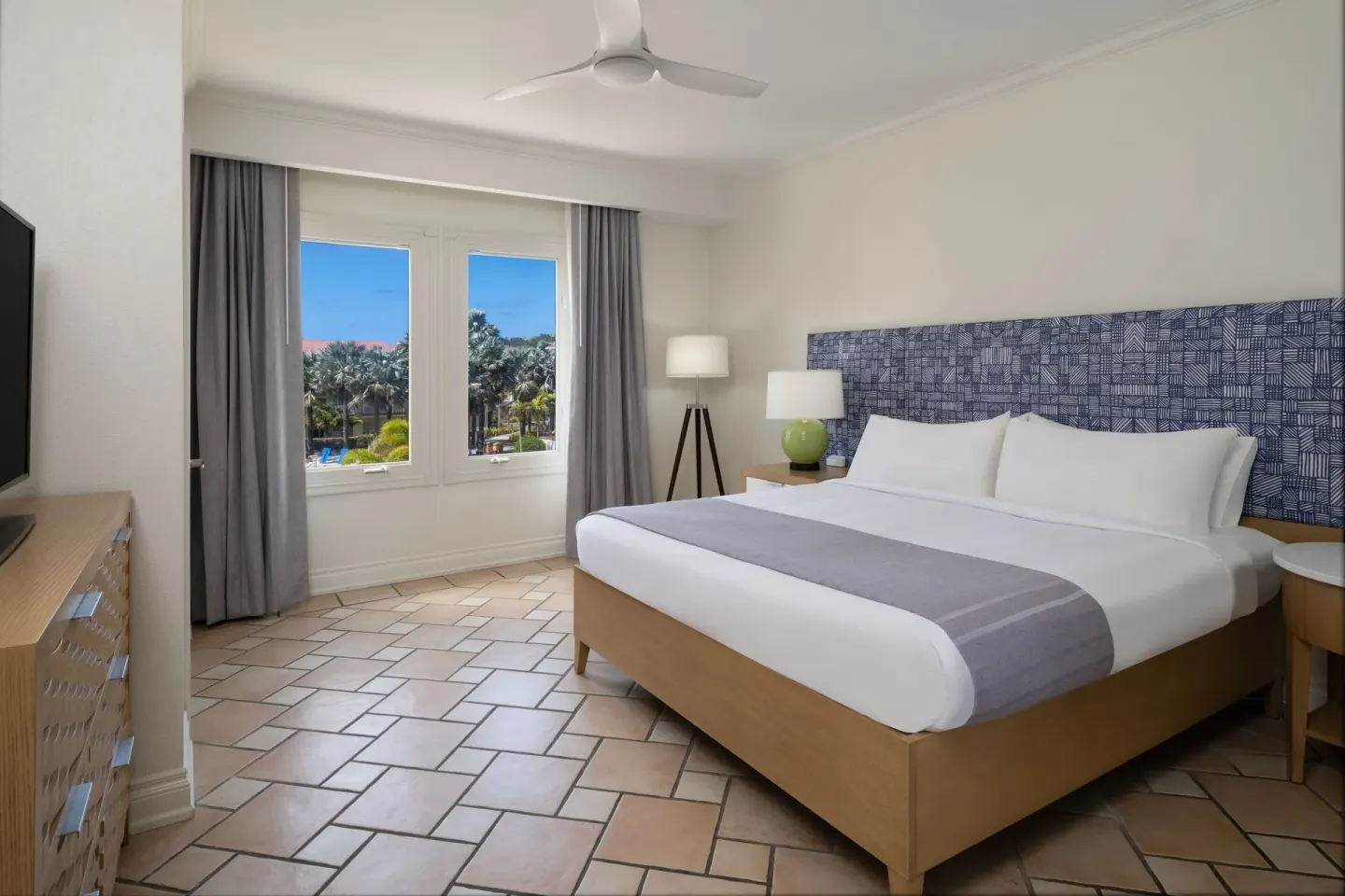 King bedroom in a three-bedroom villa at Marriott's St. Kitts Beach Club with windows and tiled floor.