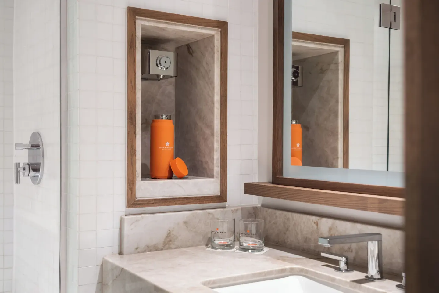 Deluxe Oceanfront bathroom vanity and shower detail at Mauna Kea Beach Hotel.