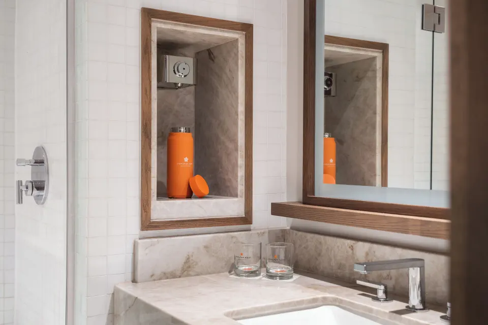 Deluxe Oceanfront bathroom vanity and shower detail at Mauna Kea Beach Hotel.