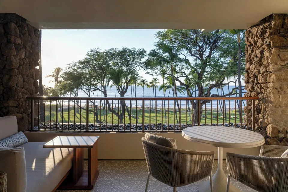 Lanai with ocean and palm views from a Beachfront room at Mauna Kea Beach Hotel.