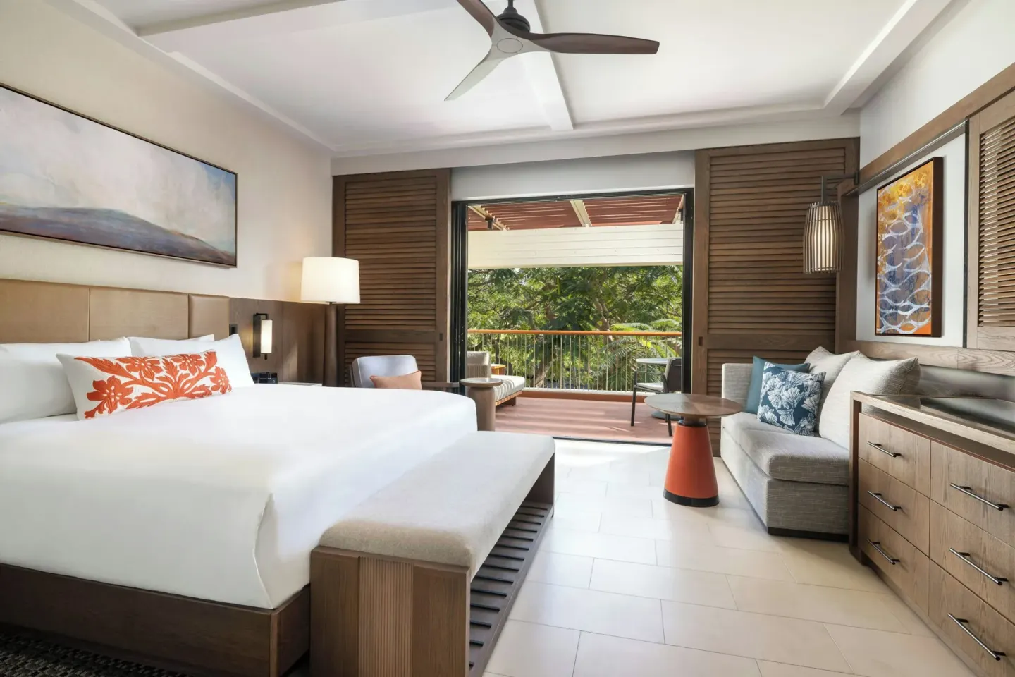 King golf-view tower room with balcony and wood shutters at Mauna Kea Beach Hotel.