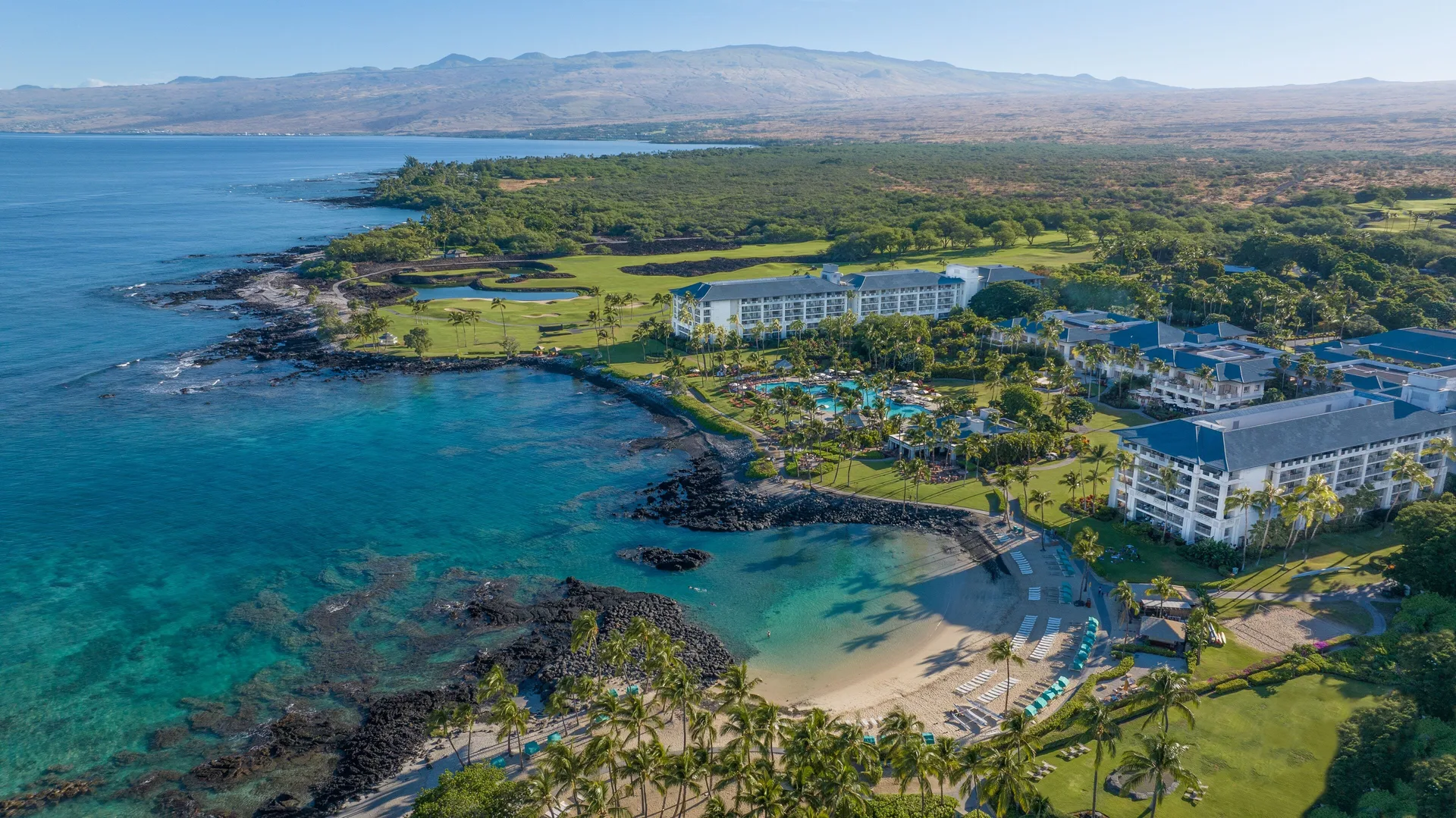 Fairmont Orchid Gold Experience luxury resort on Hawaii's Big Island with beachfront pools, tropical gardens, and elevated amenities.