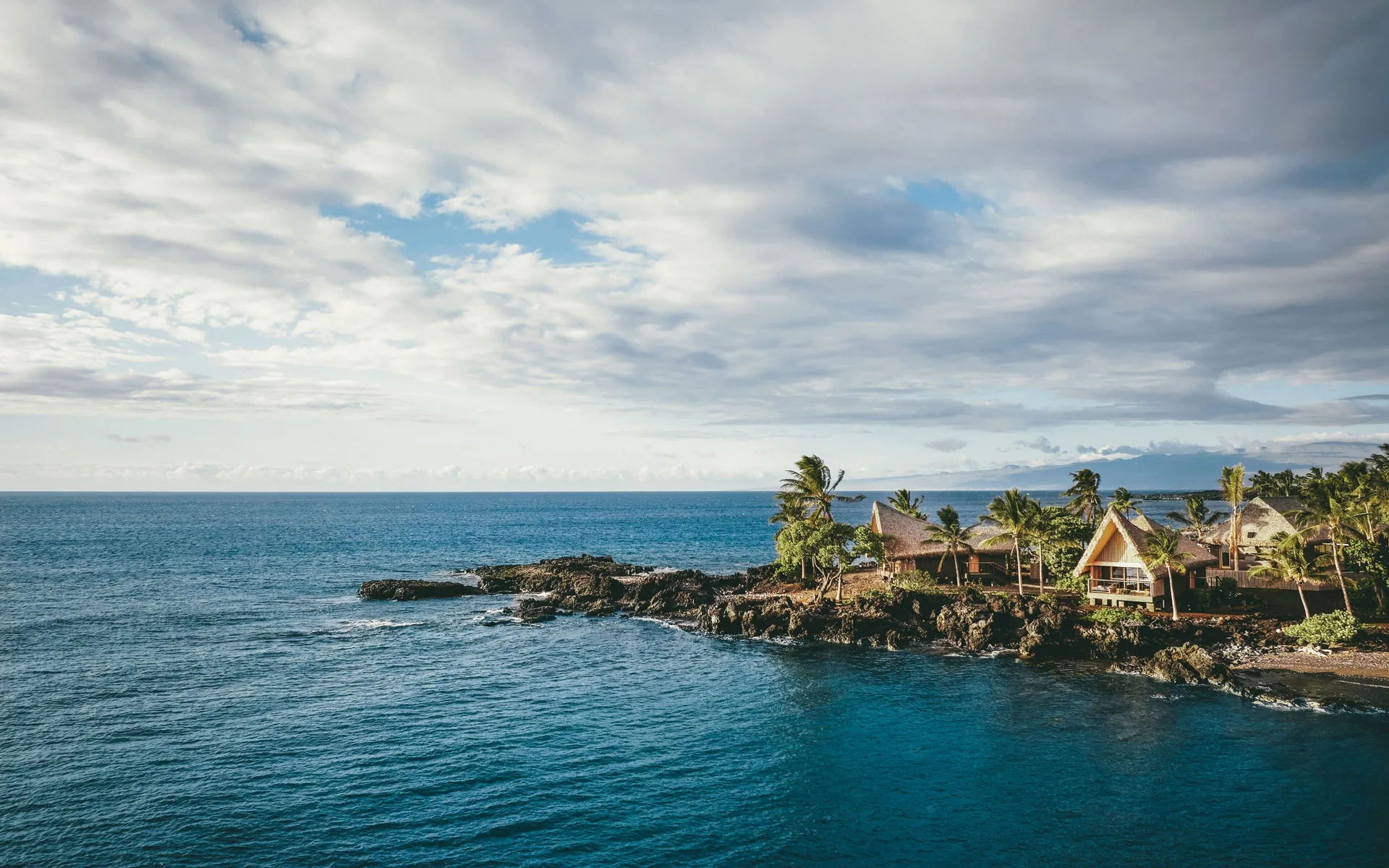 Kona Village, A Rosewood Resort with oceanfront hale bungalows, private beach, and secluded luxury setting on Hawaii's Big Island.