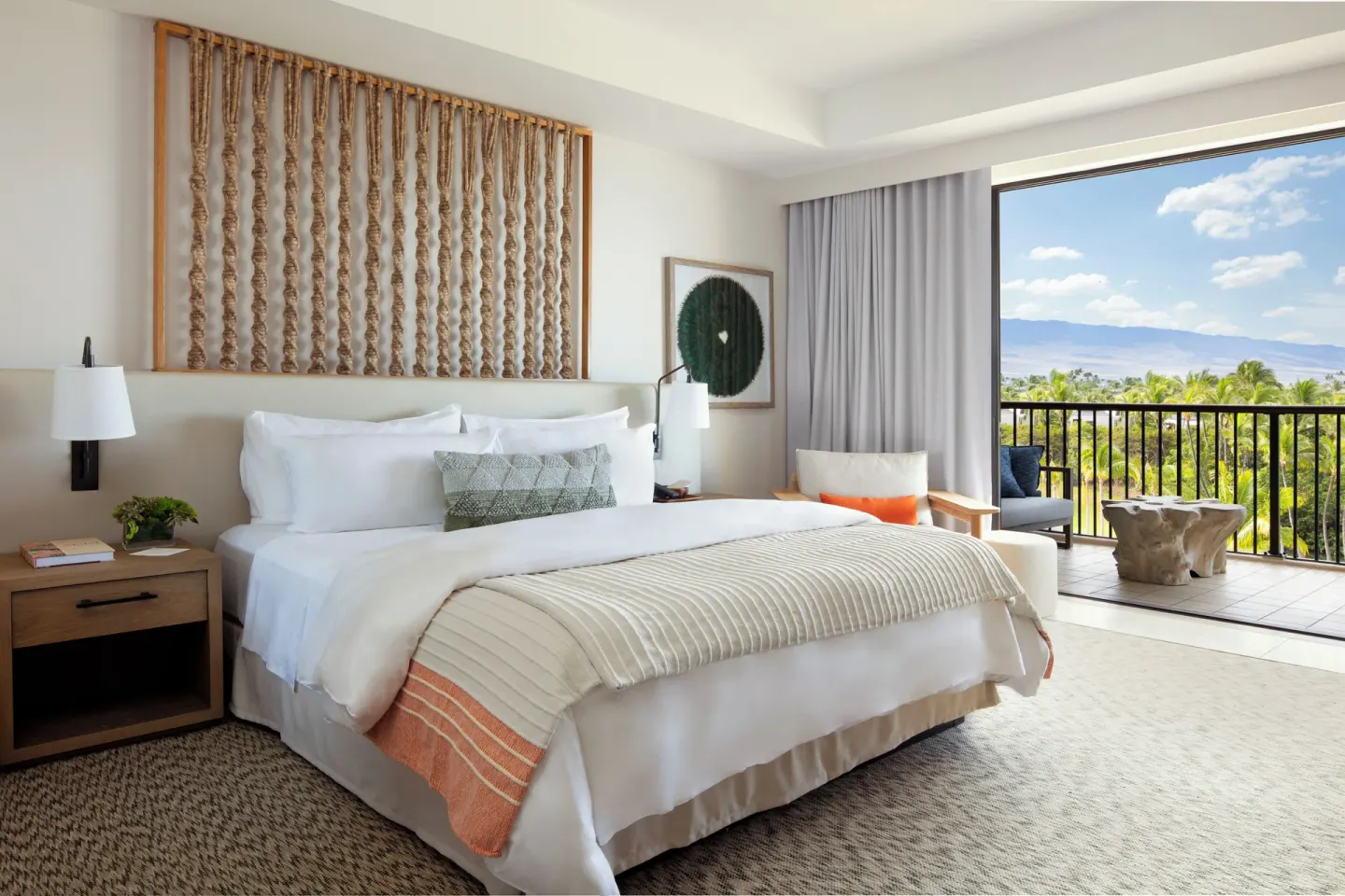 King bed guest room with balcony and mountain views at Mauna Lani.