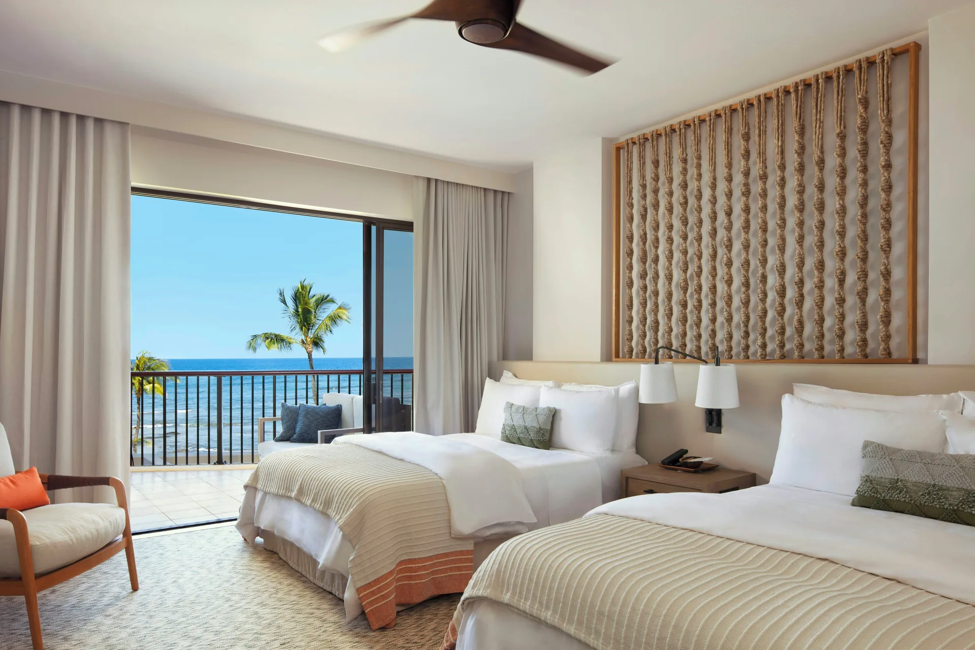 Two-bed oceanfront guest room with balcony at Mauna Lani.