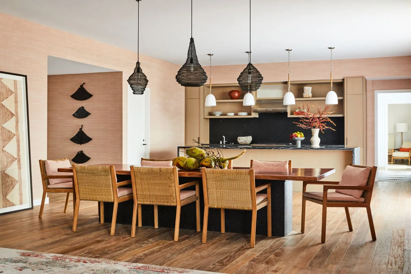 Dining table and open kitchen in a spacious suite at Mauna Lani.