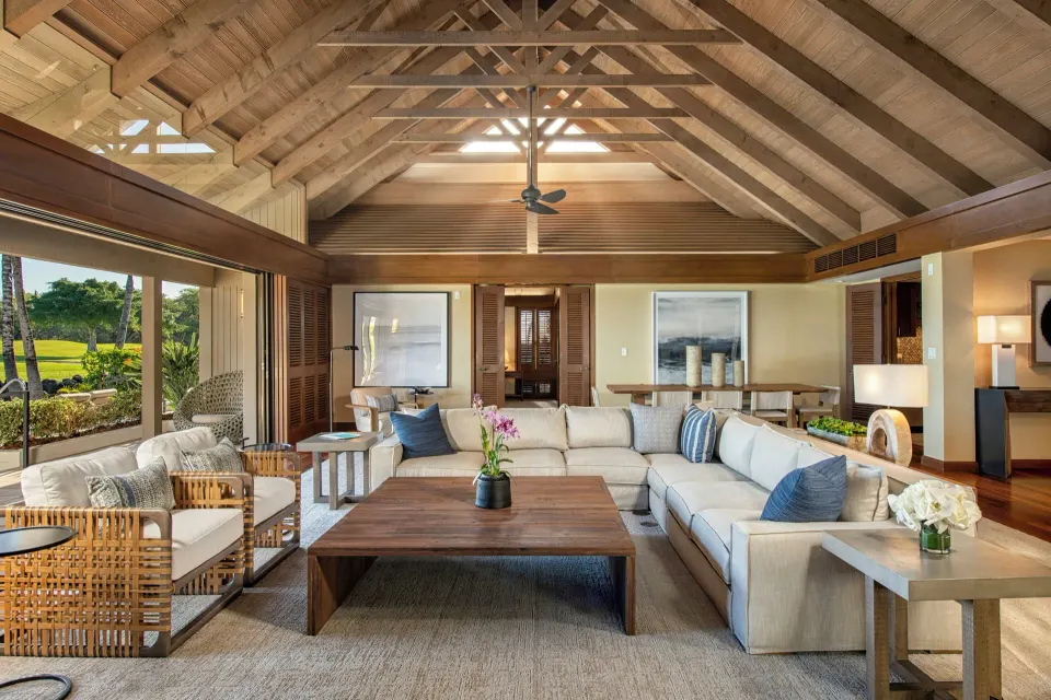 Open living room in an ocean-view villa at Mauna Lani with sectional seating and vaulted ceiling.