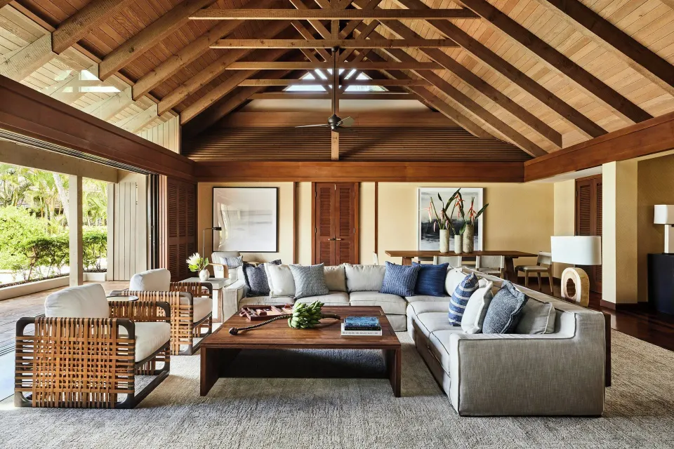 Oceanfront two-bedroom villa living room with sectional seating and vaulted ceiling at Mauna Lani.