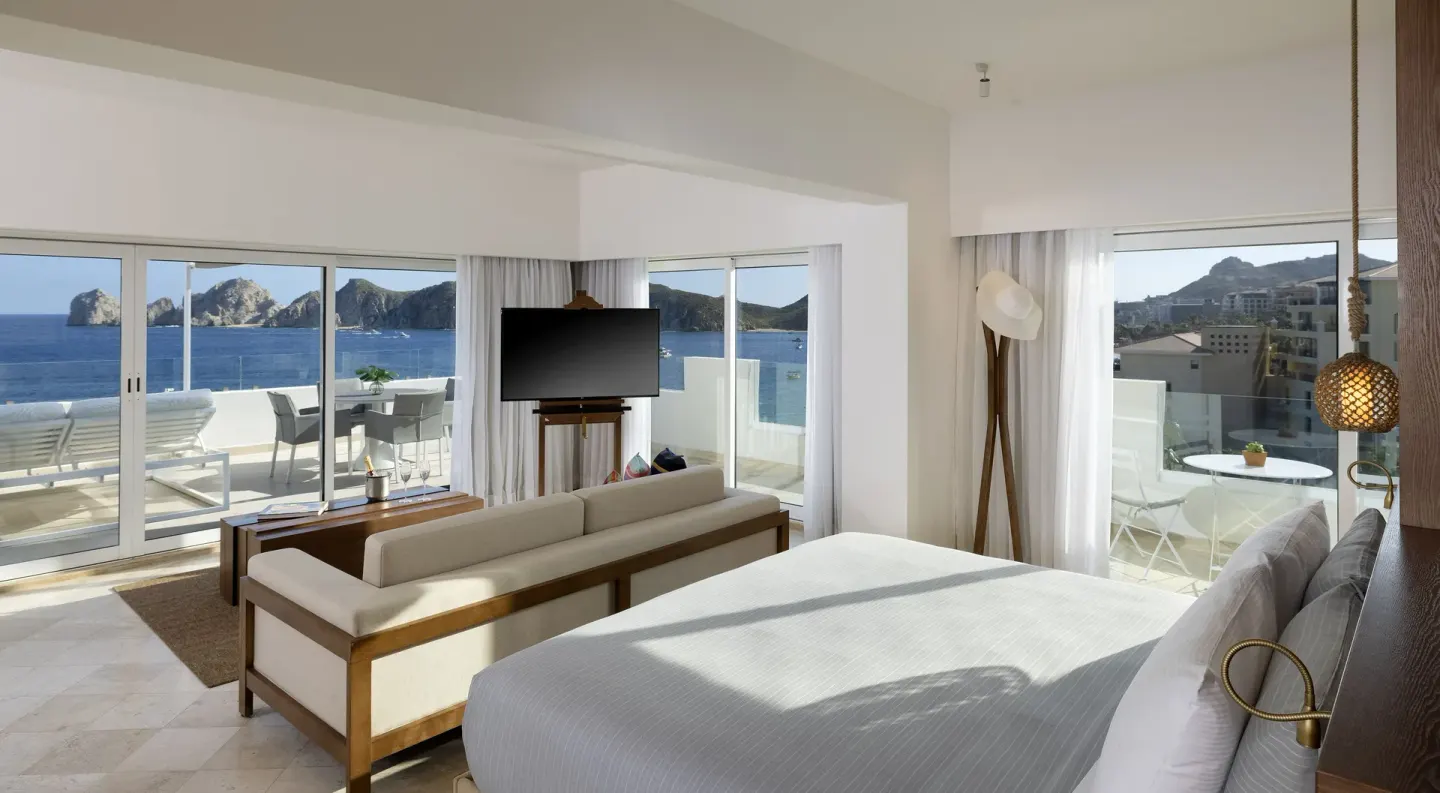 Exclusive ME+ Suite bedroom with ocean-facing terrace at ME Cabo.