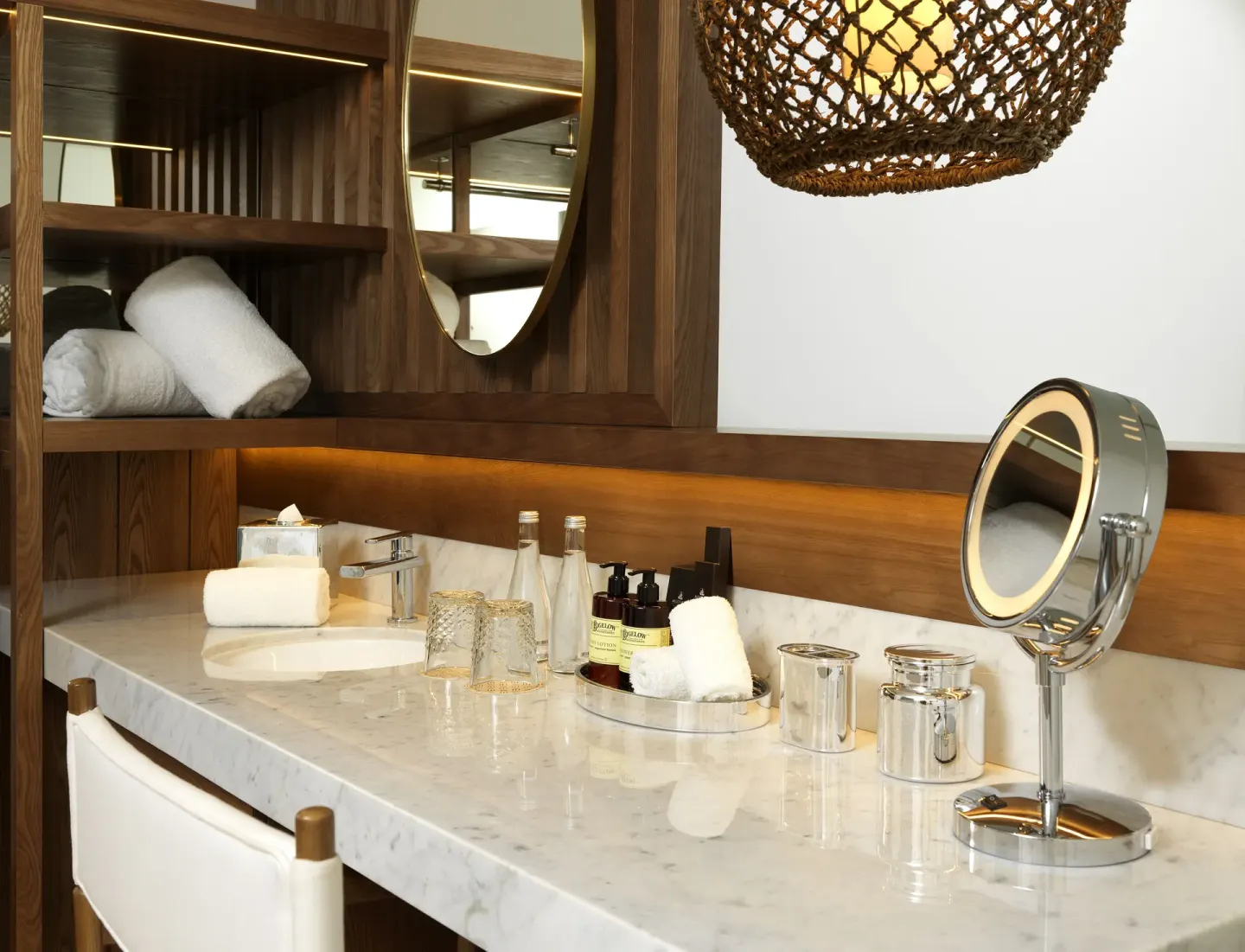 Superior ME+ with Deck marble vanity with mirror and bath amenities at ME Cabo.