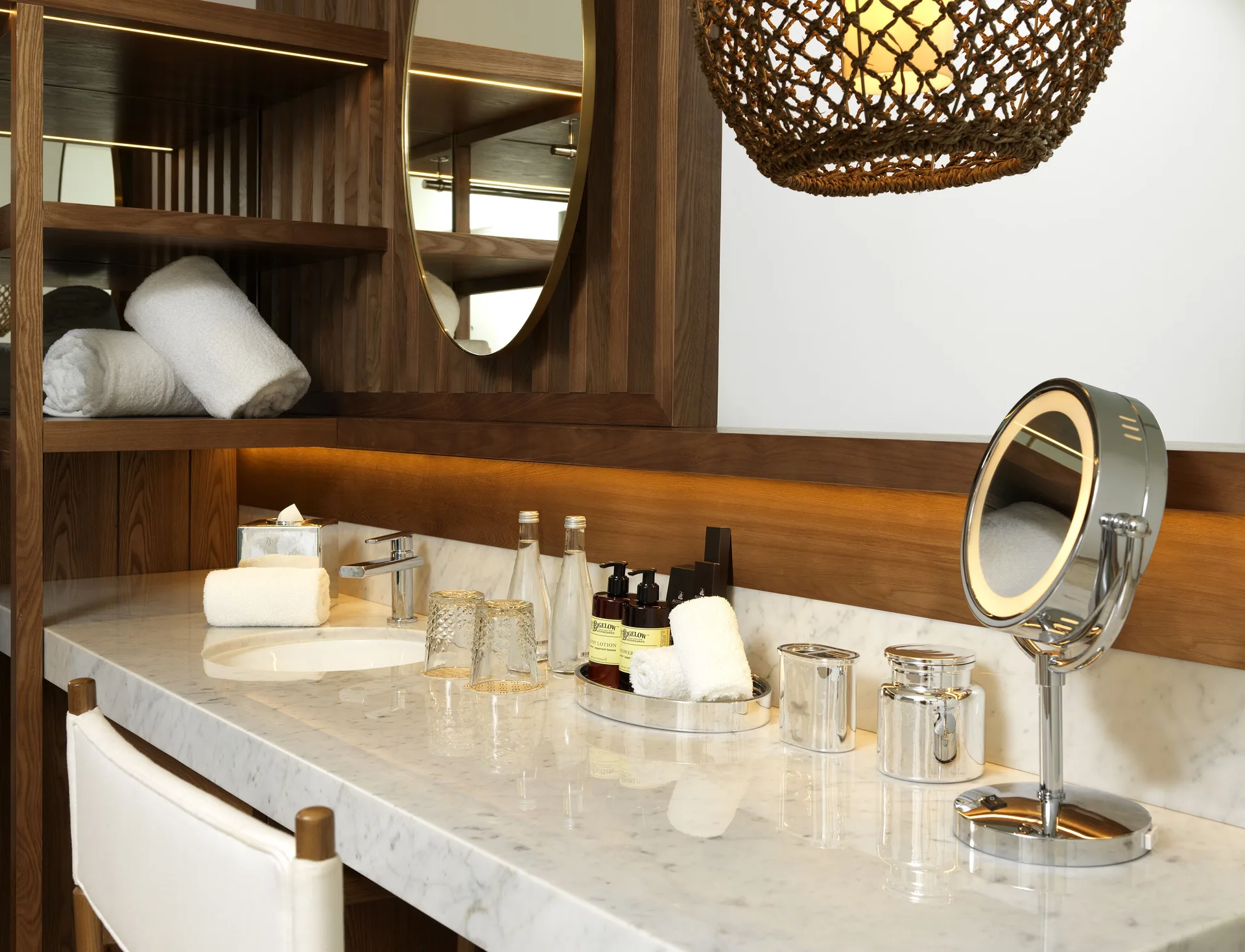 Superior ME+ with Deck marble vanity with mirror and bath amenities at ME Cabo.