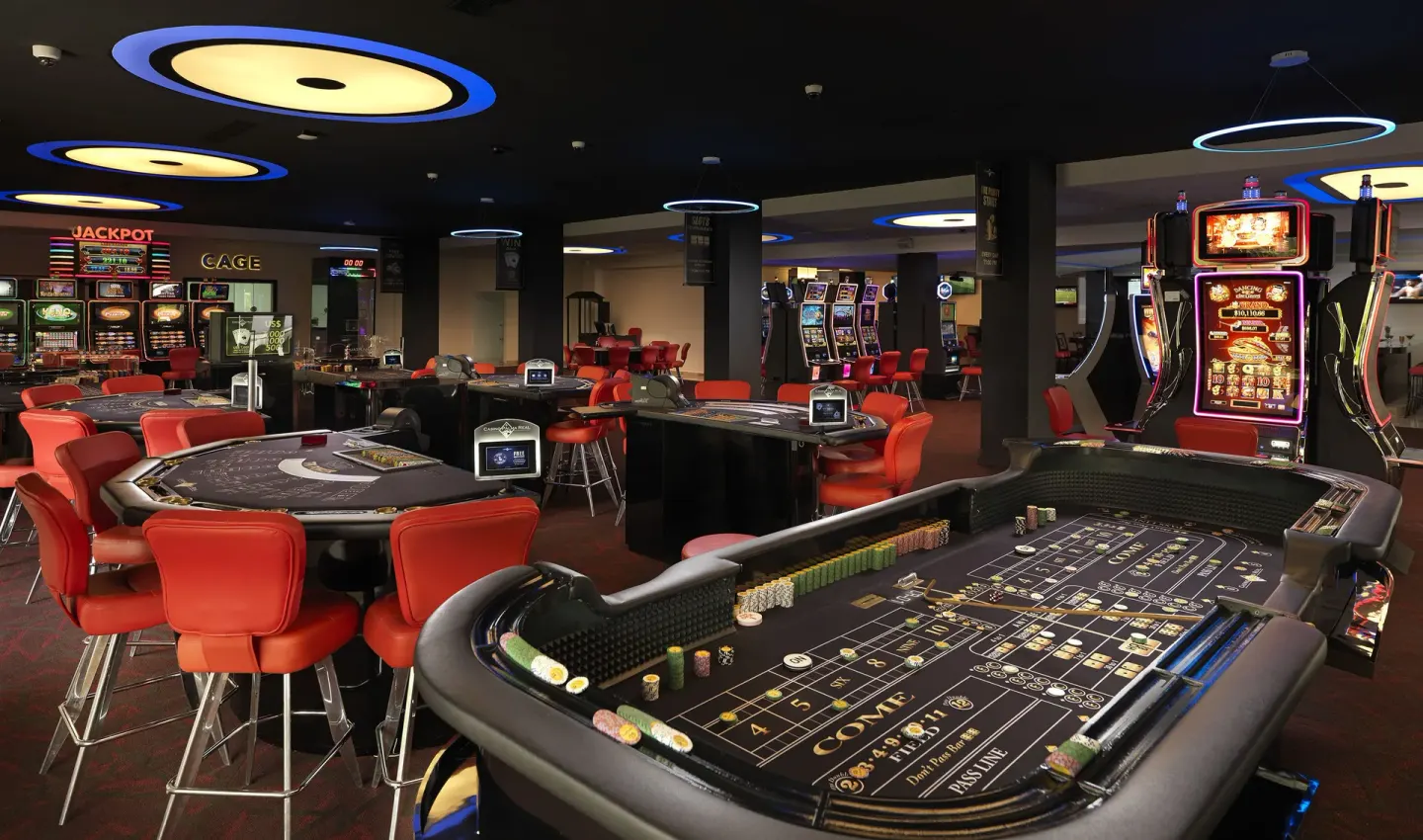 Casino floor with gaming tables and slot machines at Melia Caribe Beach Resort.