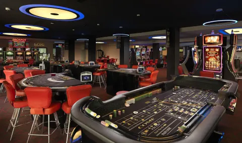 Casino floor with gaming tables and slot machines at Melia Caribe Beach Resort.