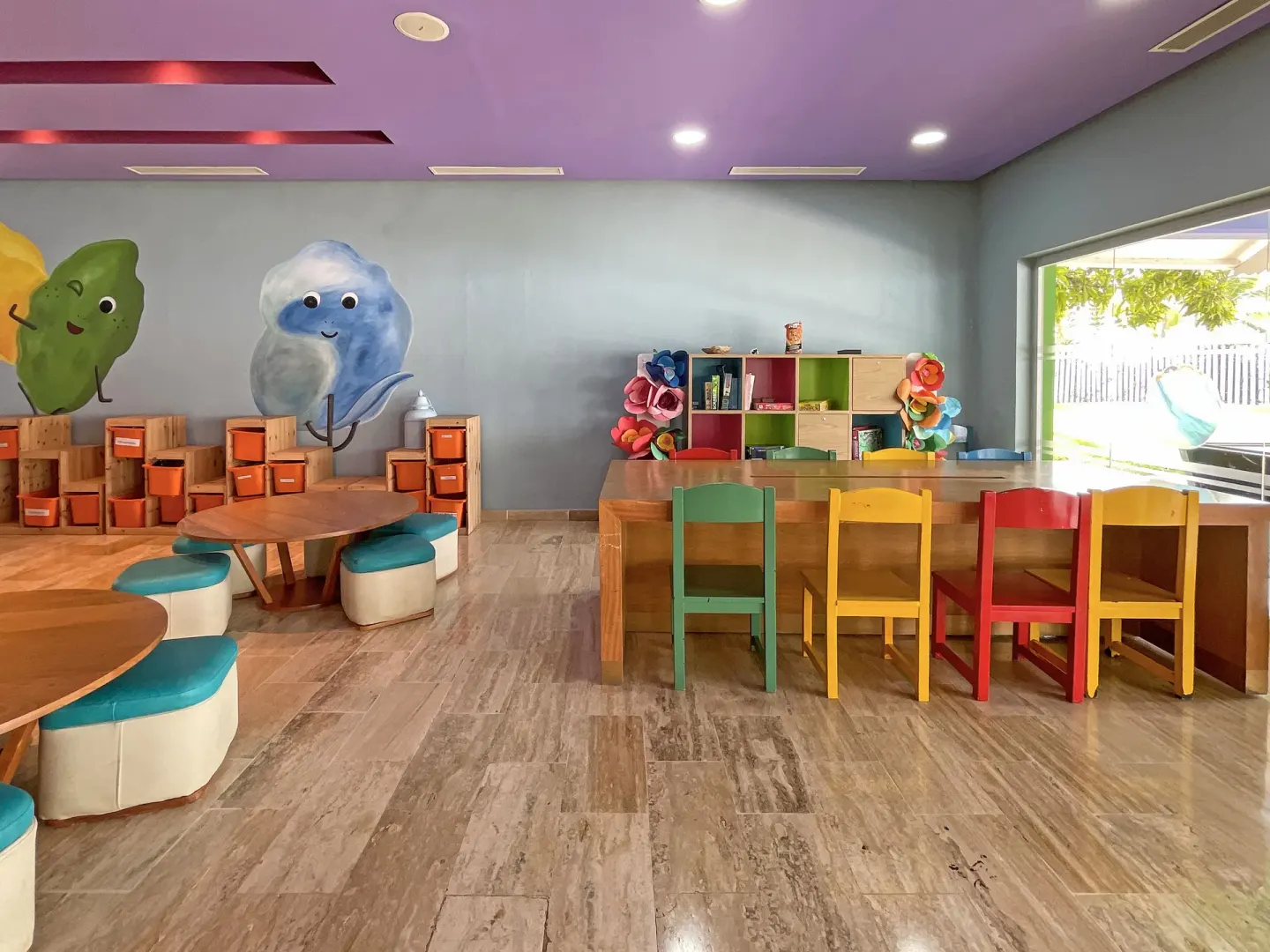 Children's activity room with craft tables and colorful chairs at Melia Caribe Beach Resort.
