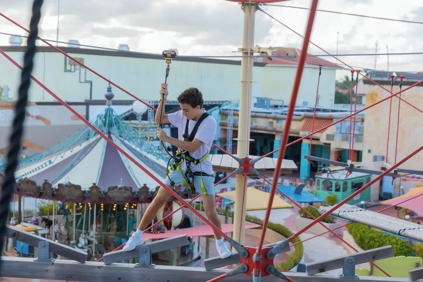 Teen crossing a high ropes course at Melia Caribe Beach Resort.