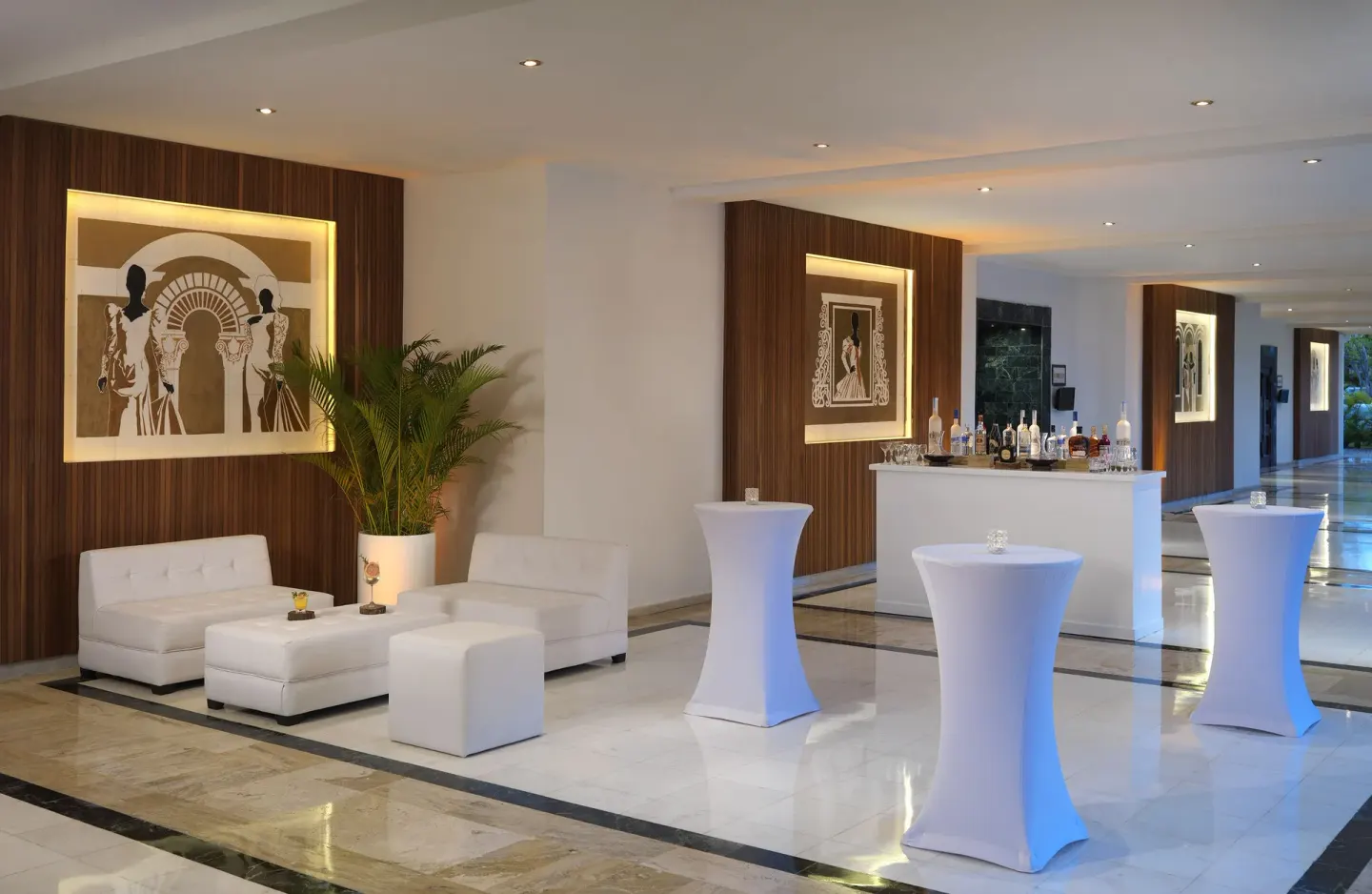 Lobby cocktail setup with white lounge seating at Melia Caribe Beach Resort.