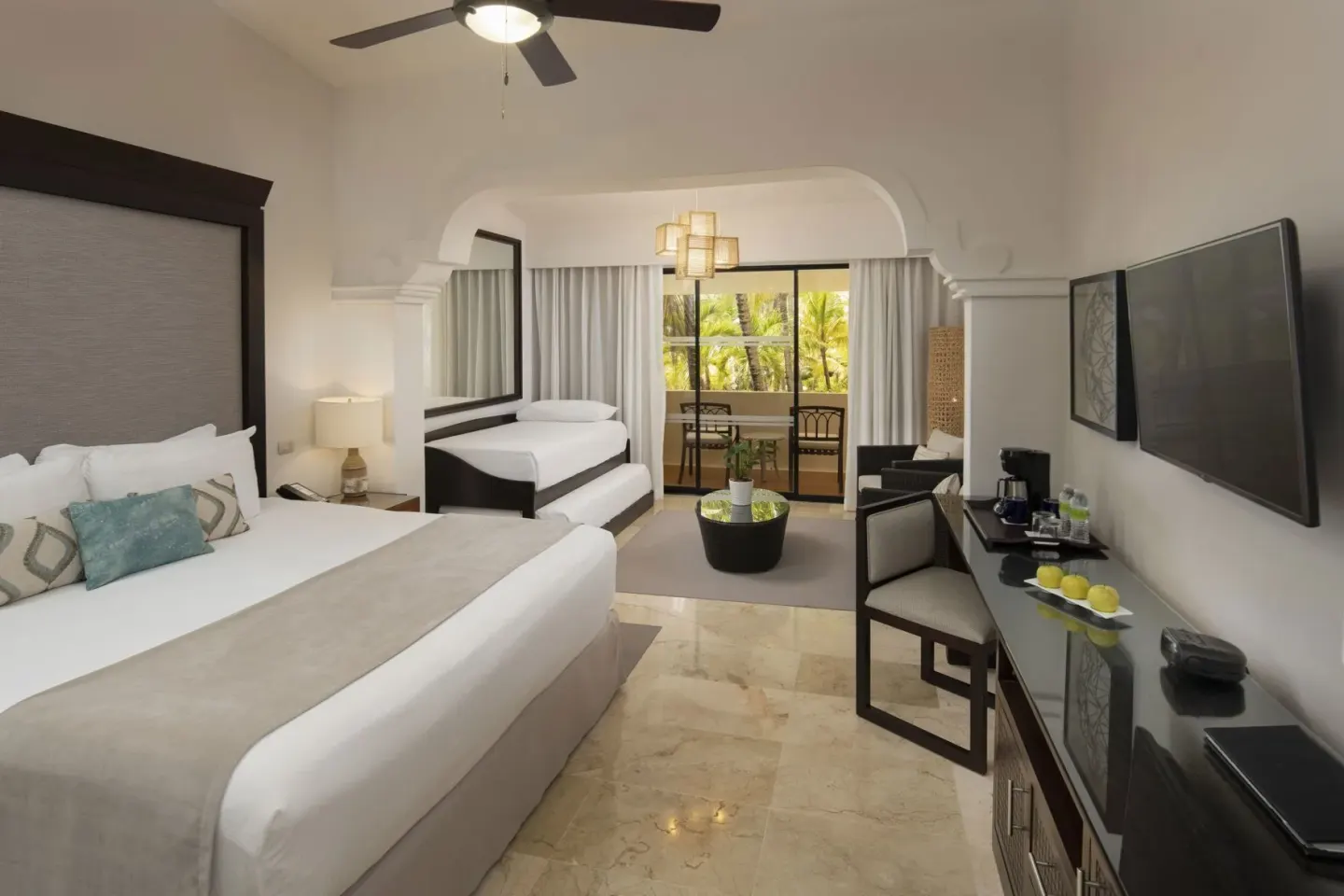 Family Room Tropical Palms with king bed and daybed at Melia Caribe Beach Resort.