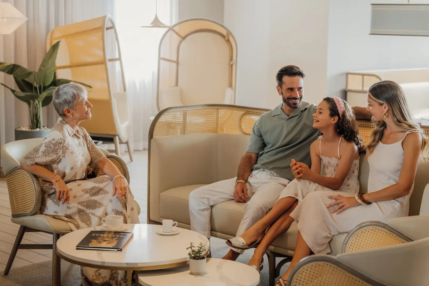 Guests sit together in a lounge seating area at Melia Casa Maya Cancun.