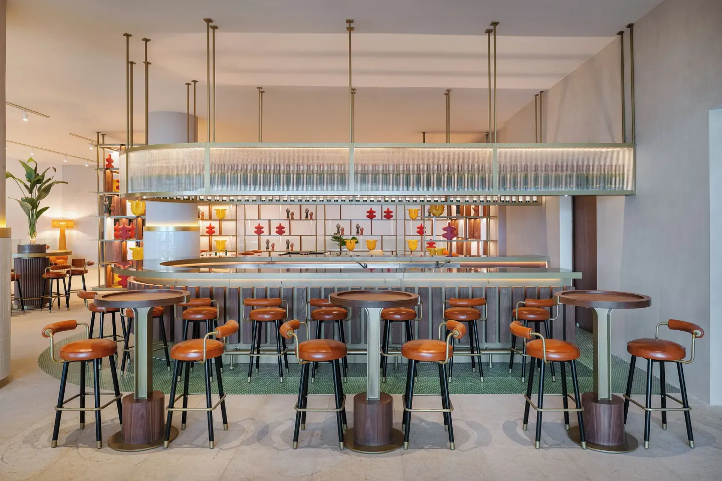 Boreal bar with high stools and colorful shelving at Melia Casa Maya Cancun.