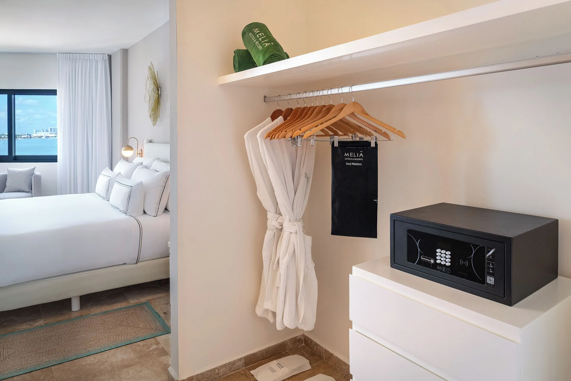 The Level Grand Suite closet with safe and bed at Melia Casa Maya Cancun.