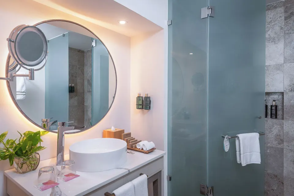 The Level Ocean View Suite bathroom vanity and glass shower at Melia Casa Maya Cancun.