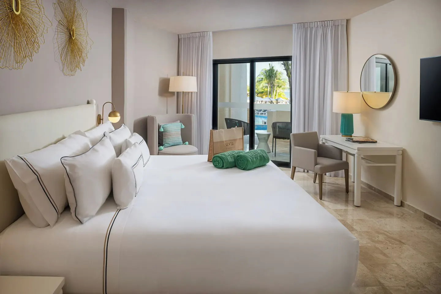 The Level Suite Swim Up bedroom with king bed at Melia Casa Maya Cancun.