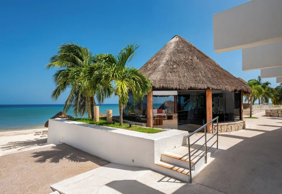 Thatched palapa dining pavilion on the beach at Melia Cozumel.