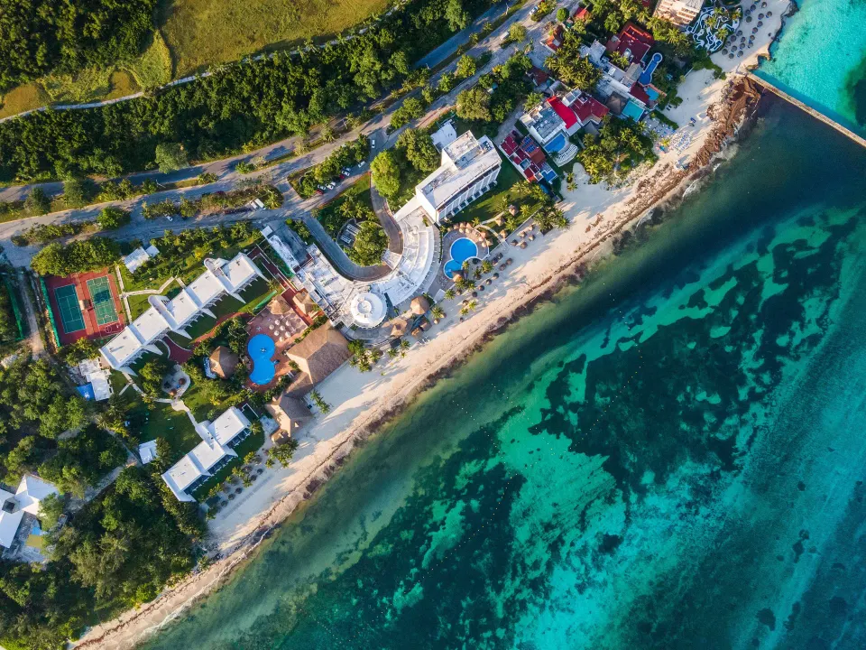 Extended aerial view of the resort beachfront and clear Caribbean waters at Melia Cozumel