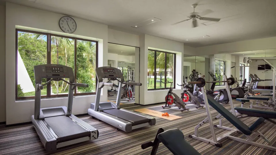 Resort fitness center with treadmills and exercise equipment at Melia Cozumel