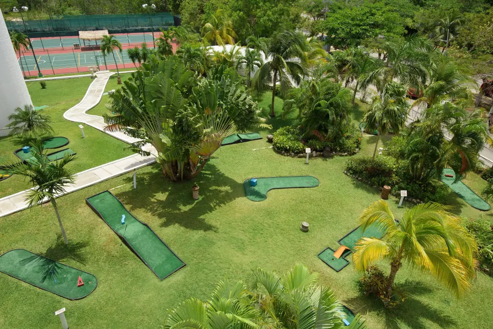 Outdoor mini golf course and landscaped grounds at Melia Cozumel
