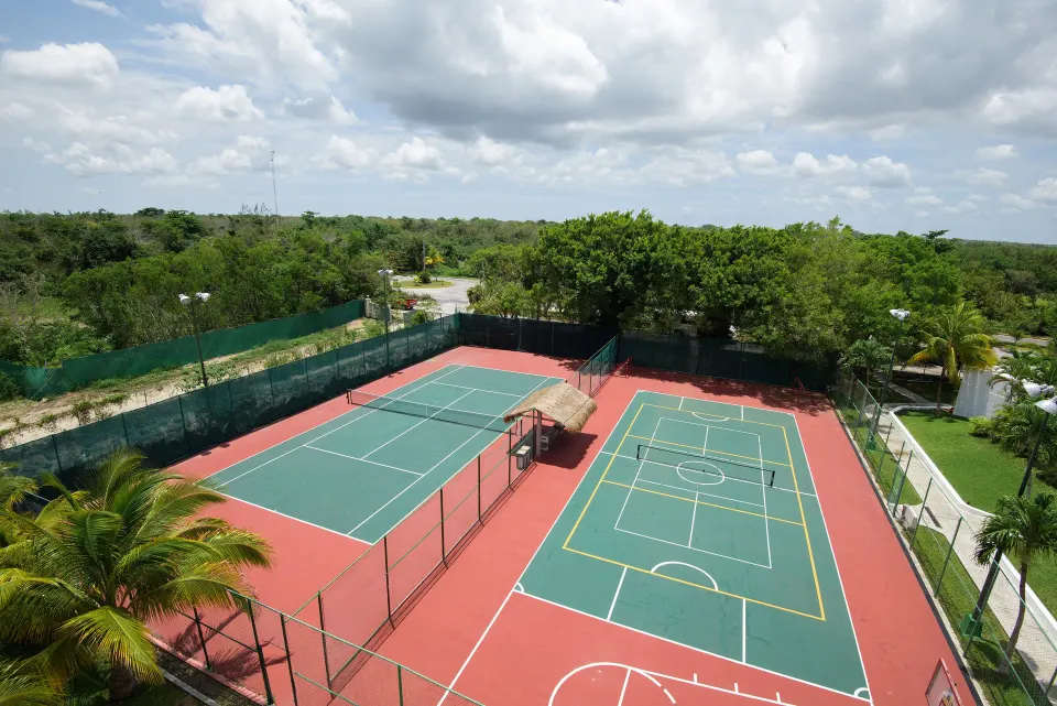 Outdoor tennis and multiuse courts viewed from above at Melia Cozumel