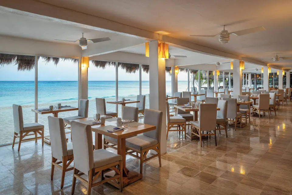 Open-air beachfront dining area overlooking the sea at Melia Cozumel