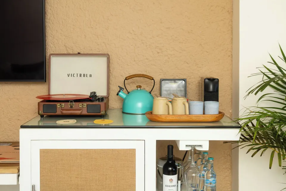 In-room beverage station with turntable, kettle and bottled water at Melia Cozumel